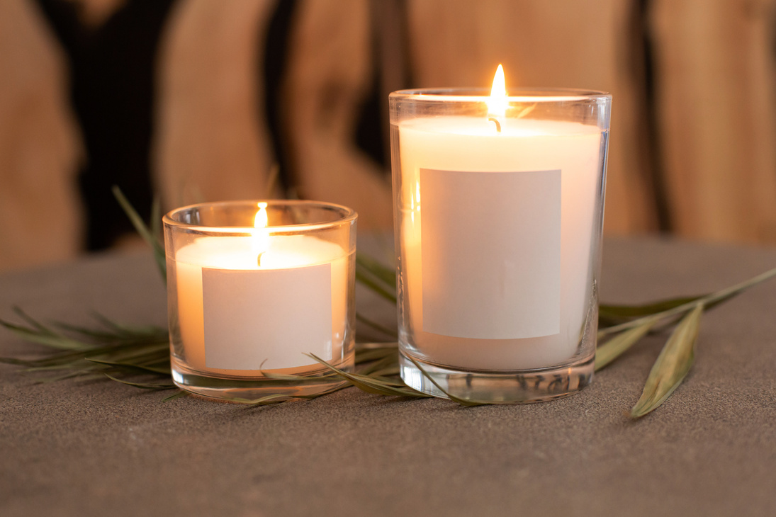 Burning Candles on Glass Containers